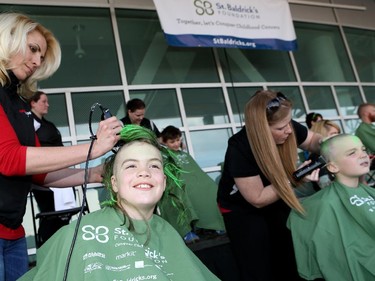 Fans get their heads shaved for St. Baldrick's Night prior to the game.