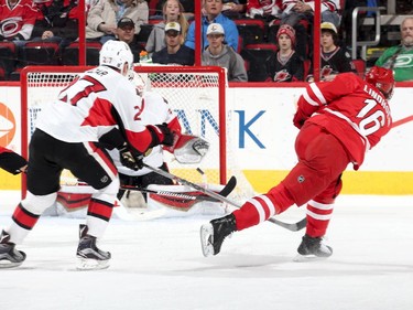 Elias Lindholm #16 of the Carolina Hurricanes fires a shot and scores a first period goal.