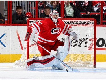 Anton Khudobin #31 of the Carolina Hurricanes deflects the puck away from the net.