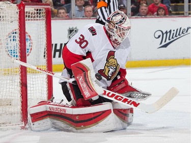 Goalie Andrew Hammond #30 of the Ottawa Senators makes a blocker save.