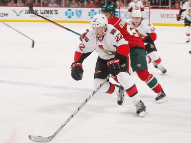 ST. PAUL, MN - MARCH 3: Erik Condra #22 of the Ottawa Senators handles the puck with Mikael Granlund #64 of the Minnesota Wild defending during the game on March 3, 2015 at the Xcel Energy Center in St. Paul, Minnesota.