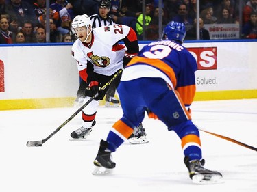 Erik Condra #22 of the Ottawa Senators shoots against Travis Hamonic #3 of the New York Islanders.