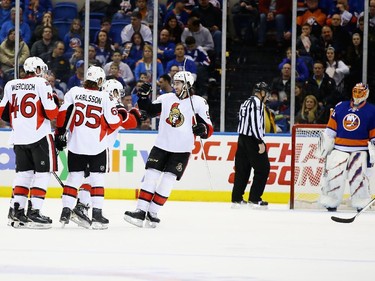 The Ottawa Senators celebrate a goal against the New York Islanders.