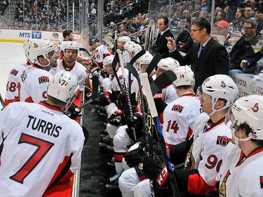 Head Coach Dave Cameron of the Ottawa Senators instructs his players during a first period stoppage of play.