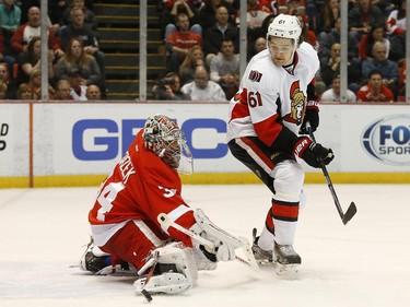Detroit Red Wings goalie Petr Mrazek (34) stops a shot by Ottawa Senators' right wing Mark Stone (61) in the first period.