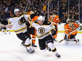 Brad Marchand of the Boston Bruins celebrates after scoring a tying goal against the Philadelphia Flyers with 14.1 seconds left in the third period.