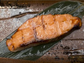 Prepared by chef Tadayoshi Oda, a fillet of succulent miso-marinated grilled salmon is surved upon a bamboo leaf at restaurant C'est Japon ¾* suisha on Mar 23. in Ottawa Ont. (Graeme Murphy/Ottawa Citizen)