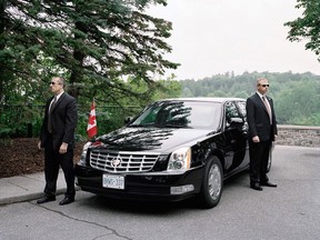 Detail from 'Prime minister's limousine with security detail,' from Tony Fouhse's project Official Ottawa.