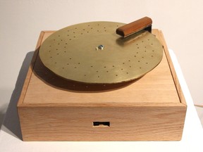 Record, which plays woodpecker sounds by banging small hammers on a log, is one piece in Annie Dunning's show at Gallery 101 in Ottawa. (Photo courtesy the gallery)