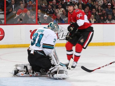 Alex Chiasson #90 of the Ottawa Senators watches the puck deflect off the shoulder of Antti Niemi #31 of the San Jose Sharks on a first period scoring chance.