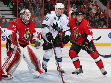 Andrew Hammond #30 and Mark Borowiecki #74 of the Ottawa Senators guard their net against Tomas Hertl #48 of the San Jose Sharks.