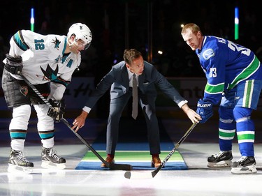 VANCOUVER, BC - MARCH 3:  NBA star Steve Nash prepares to drop the puck for the ceremonial faceoff between Patrick Marleau #12 of the San Jose Sharks and Henrik Sedin #33 of the Vancouver Canucks before their NHL at Rogers Arena March 3, 2015 in Vancouver, British Columbia, Canada.