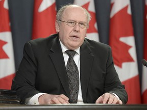 Glenn Stannard, chair of the Military Police Complaints Commission. releases the final report in the Fynes Public Interest Hearing during a news conference Tuesday, March 10, 2015 in Ottawa. A federal watchdog has painted a portrait of incompetence and negligence in the military police investigation of Cpl. Stuart Langridge's suicide, but found no evidence of bias.