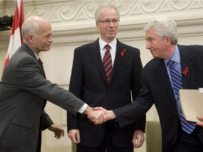 Local Input~ FILE--NDP leader Jack Layton and Bloc leader Gilles Duceppe   shake hands as Liberal leader Stephane Dion looks on after signing agreements on Parliament Hill in Ottawa Mon Dec. 1, 2008. Whether you're talking about the Conservatives' partisan, stink-bomb-laden fall economic update or the unlikely and unloved opposition coalition it helped spawn, risk, recklessness and uncertainty are the orders of the day as our federal politicians lurch into 2009.