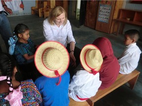 Susan Schmaltz speaks with Guatemalan children on their graduation day.