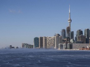 The Toronto skyline is pictured with a frozen section of Lake Ontario on Tuesday January 7, 2014, as temperatures plummet to -40 wind chill from a sharp Arctic cold front that is being dragged across the region by a winter storm.