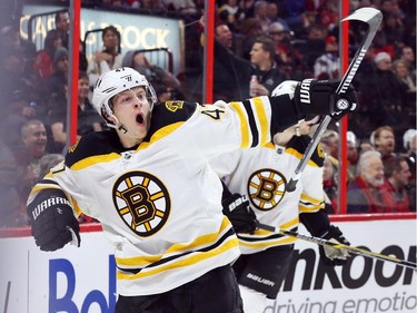 Trey Krug of the Boston Bruins celebrates his goal (and his team's fourth) against the Ottawa Senators during second period NHL action.