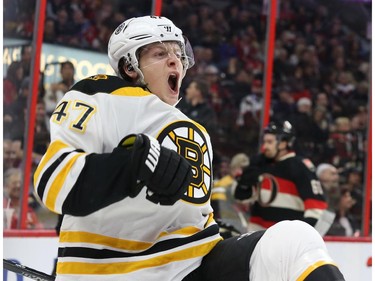 Trey Krug of the Boston Bruins celebrates his goal (and his team's fourth) against the Ottawa Senators during second period of NHL action at Canadian Tire Centre in Ottawa, March 19, 2015.   (Jean Levac/ Ottawa Citizen)
