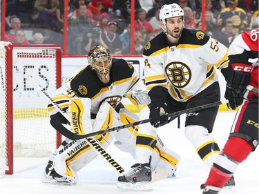 Tuukka Rask, left, and Adam McQuaid of the Boston Bruins in action against the Ottawa Senators during first period NHL action.