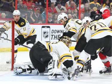 Tuukka Rask of the Boston Bruins can't control the rebound against the Ottawa Senators during first period NHL action.