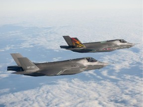 Two Lockheed Martin F-35B aircraft fly in formation on Nov. 10, 2010 at Naval Air Station Patuxent River, Md.
