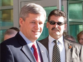 Bruno Saccomani, Canada's ambassador to Jordan, is seen in a file photo with Prime Minister Stephen Harper.