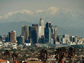 The Los Angeles city skyline sparkles after years of pollution controls. The controls have helped kids' lungs, a study shows.