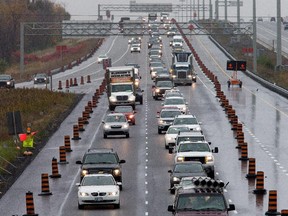 West bound (L) traffic on the Queensway, 417, looking east from the Eagleson Rd overpass, due to lane closures, traffic and construction.   Assignment - 118733 // Photo taken at 15:43 on October 20, 2014. (Wayne Cuddington/Ottawa Citizen)