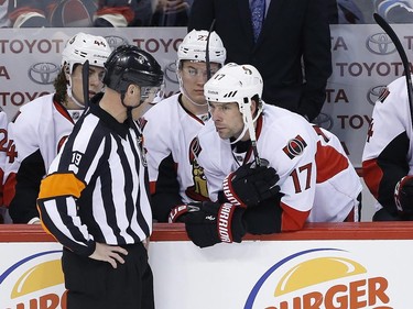 Ottawa Senators' David Legwand (17) talks to referee Gord Dwyer (19) during first period NHL action.