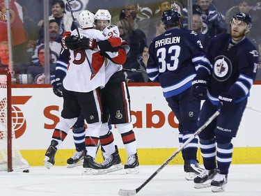 Ottawa Senators' Bobby Ryan (6) and Alex Chiasson (90) celebrate Ryan's goal against the Winnipeg Jets and Dustin Byfuglien (33) and Bryan Little (18) during second period NHL action.
