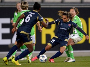Wolfsburg's Vanessa Bernauer, right, and Rosengard's Marta challenge for the ball  during the women's UEFA Champions League first leg quarterfinal soccer match between  VfL Wolfsburg and FC Rosengard from Sweden, in Wolfsburg, Germany Sunday March 22, 2015. Rachel McWhinnie writes that most female players either go to the highest level or give up, because of the headaches of recreational co-ed soccer.