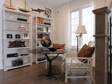 A bright library area finds a home beside the stairs on the main floor.