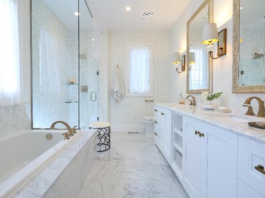 The master ensuite in muted hues offers a huge soaking tub and oversized, walk-in shower.