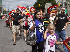 Members of the Public Service Alliance of Canada and supporters march in the Labour Day parade in 2014.