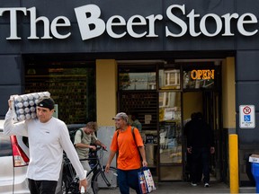 - Men carry beer that they bought out of The Beer Store on Gerrard Street East in Toronto, Ontario, August 30, 2013.