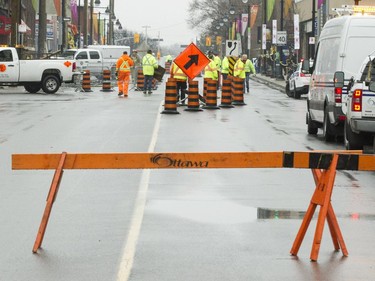 Signs and cones to redirect traffic in preparation to re-opening Bank St. An overnight fire destroyed a commercial block at the intersection of Bank and 5th Ave in the Glebe.