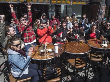 Ottawa Senators fans celebrate on the patio at The Lieutenant's Pump on Elgin St.  The Senators 3-1 victory over the Philadelphia Flyers cinched a playoff spot on Saturday.