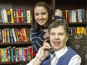 Mary Smith is seen on the phone at The Good Companions Seniors' Centre with Rachel Sokolsky, co-ordinator of Seniors' Centre Without Walls, a three-year pilot  project designed to give isolated seniors and adults with physical disabilities new opportunities through the use of their phone.