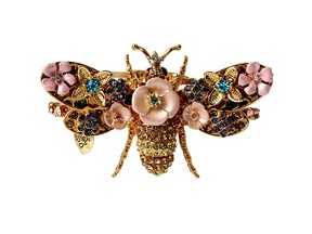 FLY AWAY WITH ME -
It’s time to be the queen bee with this Betsey Johnson hinged bangle with flowers and crystal accents. $68 at thebay.com.