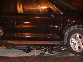 Bicycle remained jammed beneath sport-utility vehicle after collision at Maitland and Glenmount avenues shortly after 8 p.m. Friday.
