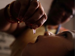 A health worker administers a polio drop to an infant as part of Mission Indradhanush on World Health Day in Bhubaneswar, India, Tuesday, April 7, 2015. Mission Indradhanush is a nationwide campaign that aims to immunize all children against seven vaccine preventable diseases namely diphtheria, whooping cough, tetanus, polio, tuberculosis, measles and hepatitis.