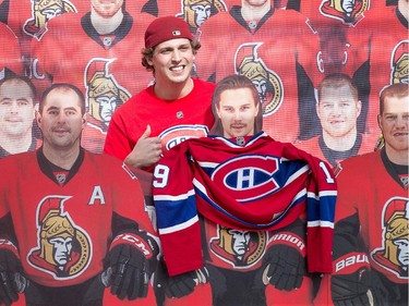 A Montreal fans quickly puts his jersey over a cutout of Erik Karlsson on display in the Fan Zone and has a buddy shoot the photo as the Ottawa Senators get set to take on the Montreal Canadiens at the Canadian Tire Centre in Ottawa for Game 6 of the NHL Eastern Conference playoffs on Sunday evening.