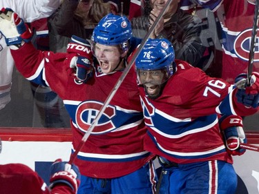 Montreal Canadiens' Alex Galchenyuk, left, celebrates his winning goal over the Ottawa Senators with teammate P.K. Subban during first period overtime of Game 2 NHL Stanley Cup first round playoff hockey action Friday, April 17, 2015 in Montreal. The Canadiens beat the Senators 3-2 to take a 2-0 lead in the best-of-seven series.