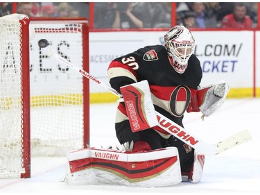 Andrew Hammond of the Ottawa Senators makes the save against the Tampa Bay Lightning during second period NHL action.