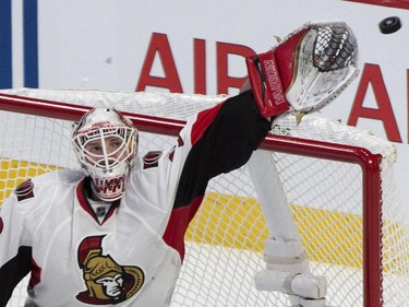 The puck is out of rach for Ottawa Senators goalie Andrew Hammond as they face the Montreal Canadiens during third period of Game 2 NHL Stanley Cup first round playoff hockey action Friday, April 17, 2015 in Montreal.