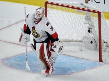 Ottawa Senators goalie Andrew Hammond leaves his crease after letting in the winning goal in overtime on Friday, April 17, 2015 in Montreal.