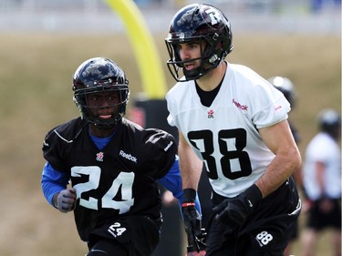 Brad Sinopoli, right, is defended by Jerrell Gavins (24) during practice at TD Place.