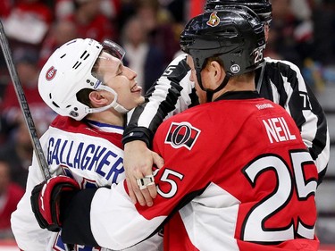 Brendan Gallagher (L) shows his distain for Chris Neil by sticking out his tongue at him in the second period as the Montreal Canadiens and the Ottawa Senators play game 3 of the first round playoffs at Canadian Tire Centre.