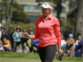Brooke Henderson waves to the gallery after making a birdie putt on the sixth green of the Lake Merced Golf Club during the final round of the Swinging Skirts LPGA Classic golf tournament on Sunday, April 26, 2015, in Daly City, Calif.
