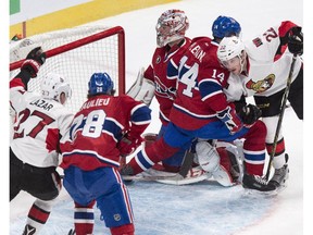 Ottawa Senators' Erik Condra, right, scores past Montreal Canadiens goalie Carey Price  Thursday, March 12, 2015 in Montreal.